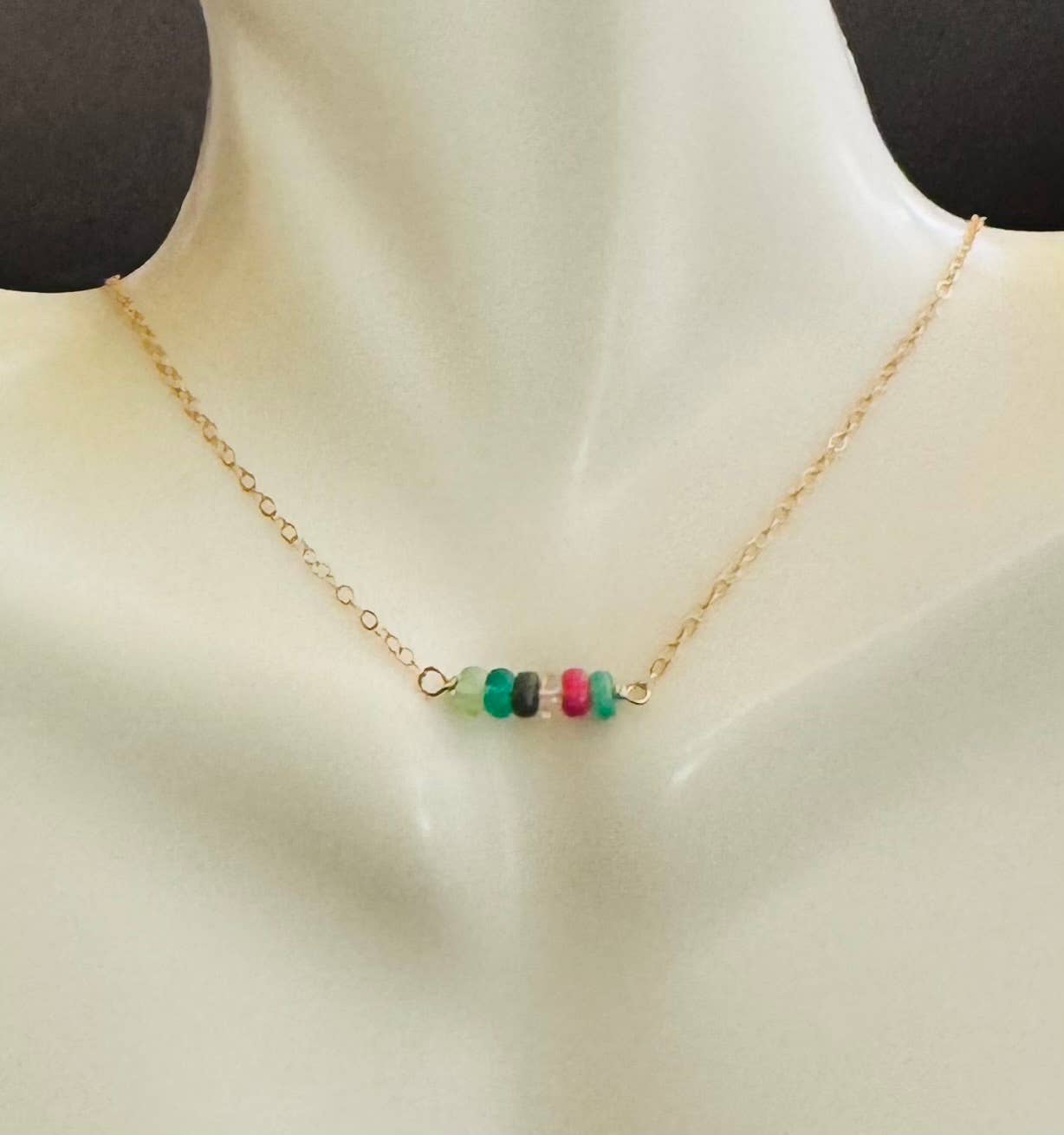 Opals on gold necklace