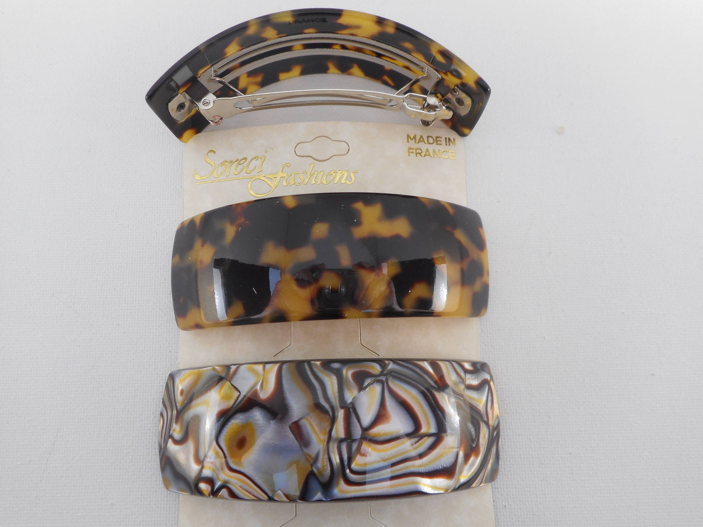 Wide curved barrette