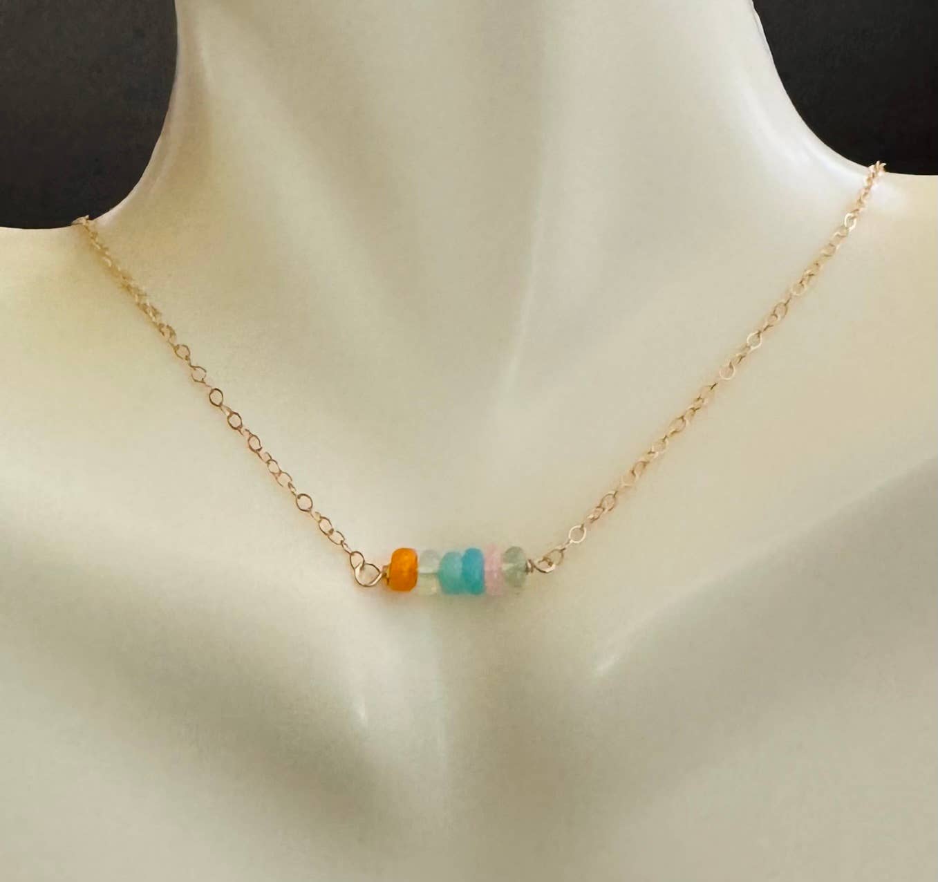 Opals on gold necklace