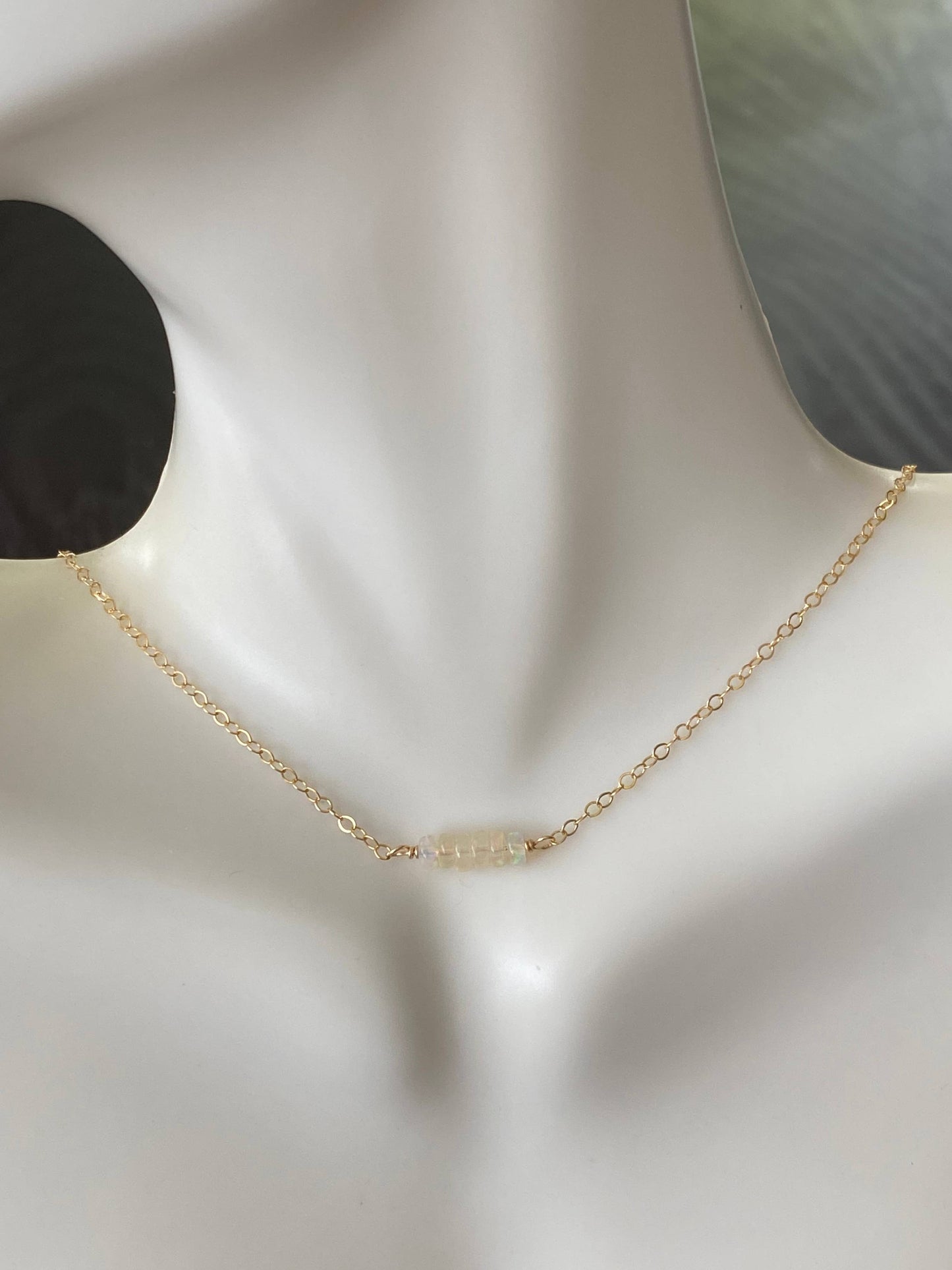 Opals on gold necklace